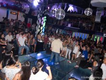 A singer performs inside Prizma, a popular reggaeton club in Medellin.