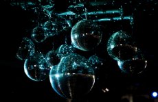 Disco balls hang above the dance floor o